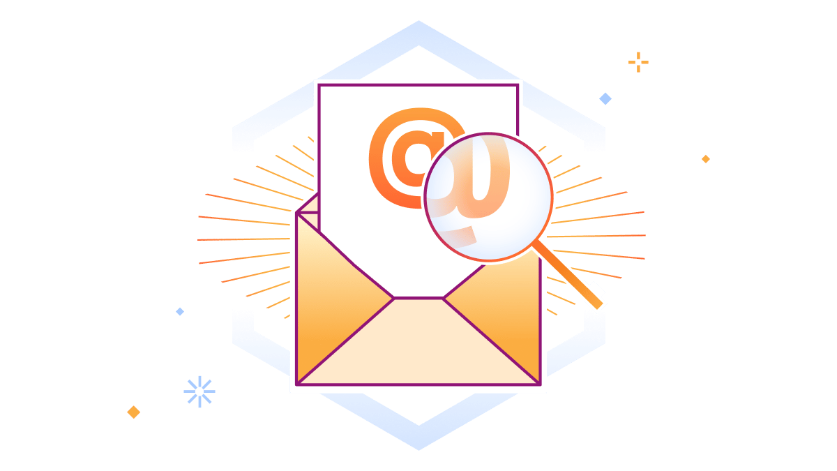 Il segno @ delle e-mail viene ingrandito da una lente d'ingrandimento